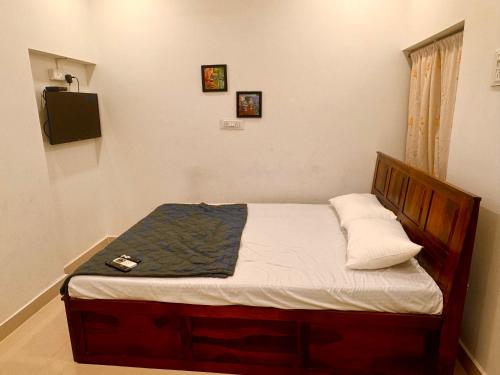 a small bed in a room with at Vibes stay in in Hyderabad