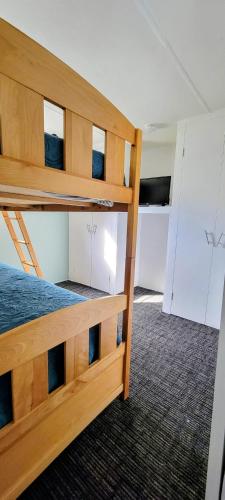 a bedroom with two bunk beds in a room at Welcome to Bluebird Cottage in Lakeview