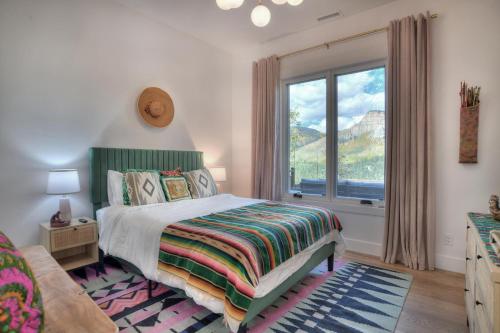 a bedroom with a bed and a large window at 2001 Lake Purgatory Drive in Durango