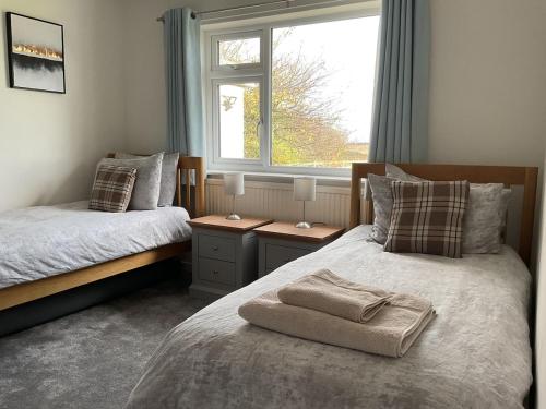 Katil atau katil-katil dalam bilik di Summerfield Bungalow