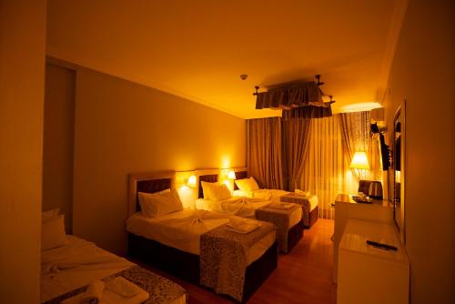 Ένα ή περισσότερα κρεβάτια σε δωμάτιο στο SRF Boutique Hotel