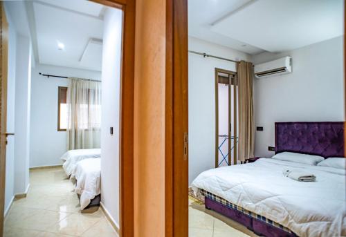 Ένα ή περισσότερα κρεβάτια σε δωμάτιο στο Cozy Vibes in the Heart of Ville Haute