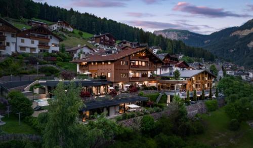 an aerial view of a resort in the mountains at Gran Tubla Apartments Dolomites in Ortisei