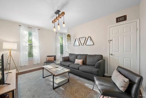 a living room with a couch and a table at The Luxe Pearl Residences 870-5 in Columbus