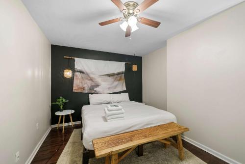 a bedroom with a bed with a ceiling fan at The Luxe Pearl Residences 870-5 in Columbus