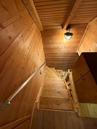 an inside view of a wooden sauna with stairs at Vikendica za odmor in Dobra Voda