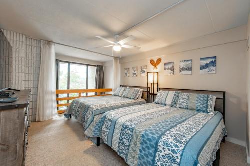 a bedroom with two beds and a window at 508G Two Bedroom One Bath in Thayerville