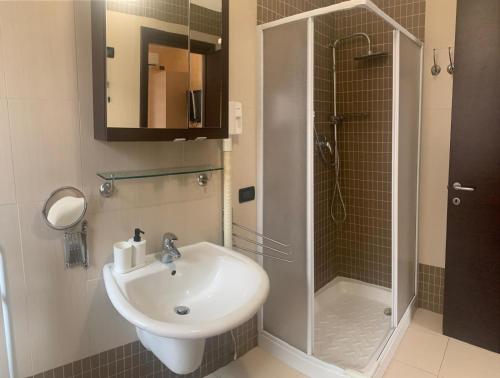 a bathroom with a sink and a shower at B&B al CASTELLO Torremaggiore in Torremaggiore