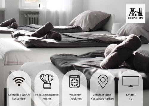 Een bed of bedden in een kamer bij RuhrpottImmo - Zentrale Wohnung in Iserlohn - bis zu 7 Pers