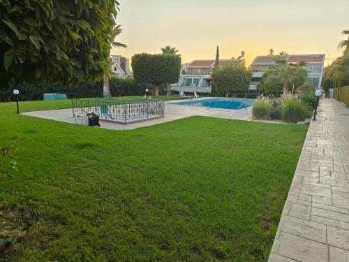 a park with a playground and a swimming pool at Brand new sea view walking distance to the sea 200m in Limassol