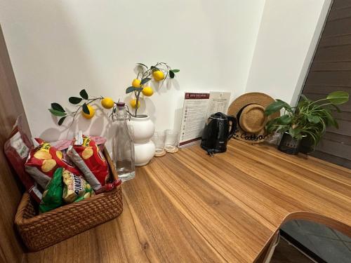 a table with snacks on top of a wooden floor at Mê Stay Cat Ba in Cat Ba