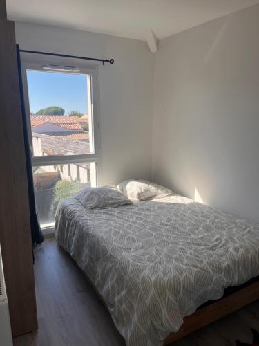 Postel nebo postele na pokoji v ubytování Charmante maison récente saint xandre