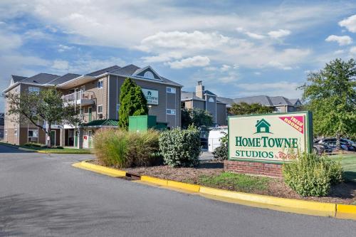 a sign in front of a house with a home appliance sign at Birch Hill Suites Louisville in Louisville