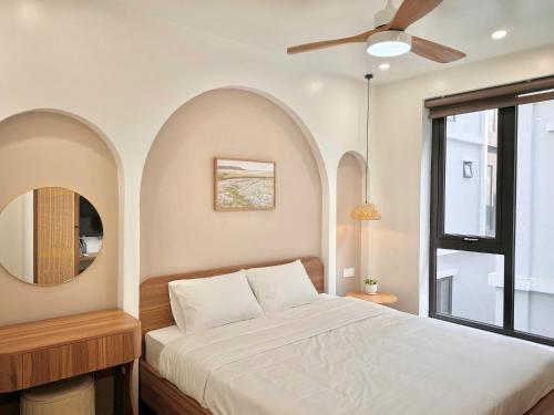 Ένα ή περισσότερα κρεβάτια σε δωμάτιο στο Mê Stay Cat Ba