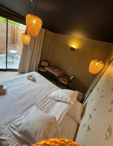 Ліжко або ліжка в номері Hostellerie Normande