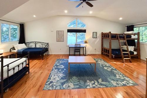 a living room with two bunk beds and a couch at Bon Vie Chalet in Ludlow