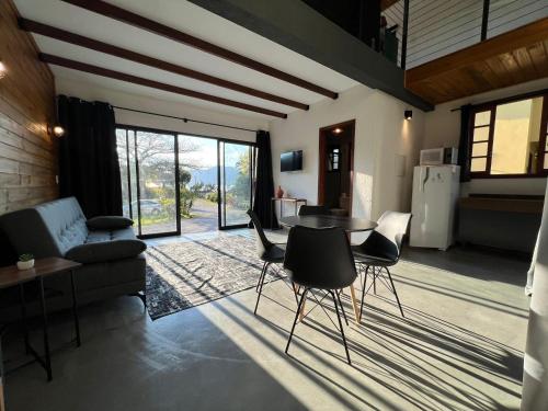 a living room with a table and chairs at Pousada Ilha da Magia in Florianópolis