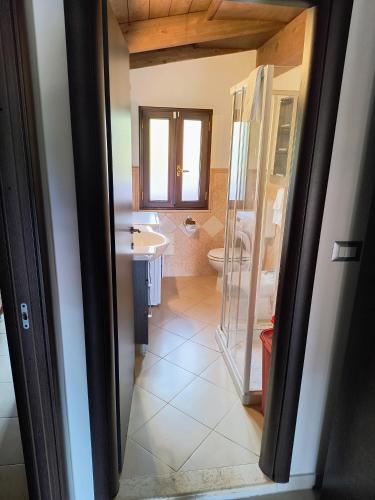 a bathroom with a shower and a sink and a toilet at MAREMONTI alloggio turistico in Formia