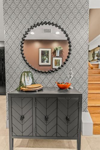 a mirror on a wall in a kitchen with a counter at 5 bdrm - Heated Indoor Pool - Roof Top Deck in Philadelphia