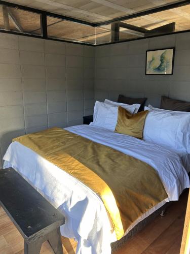 a bedroom with a large bed in a room at Pedre Loft in La Pedrera