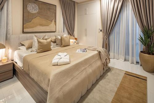 a large bedroom with a large bed with a white bedspread at Grey Assets - Apartment 2 in Spintex