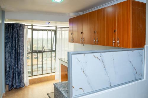 a large aquarium in a room with a large window at The Mark Hotel in Ruiru