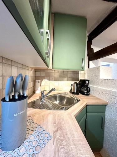 a kitchen with a sink and a counter top at Baumeisterhaus Suite in Bad Hersfeld