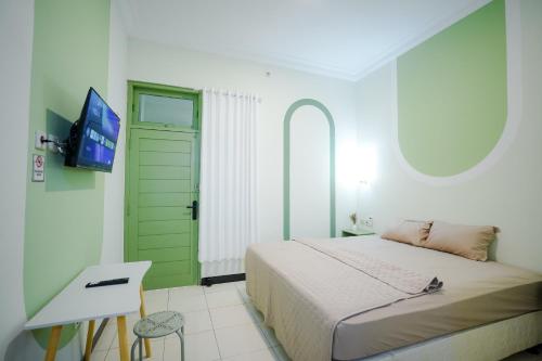 Postel nebo postele na pokoji v ubytování Kod Avlaha Bed & Coffee