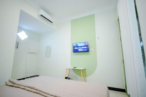 TV a/nebo společenská místnost v ubytování Kod Avlaha Bed & Coffee