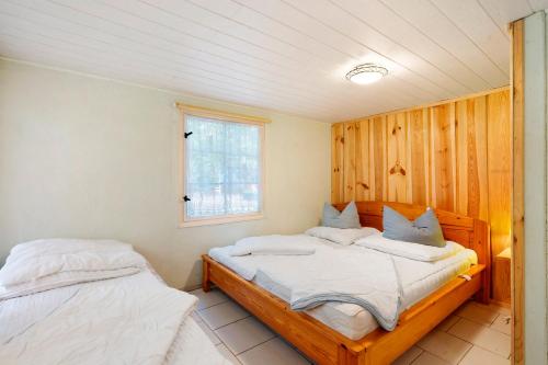 Ένα ή περισσότερα κρεβάτια σε δωμάτιο στο Bungalow 8 - Finnhütte