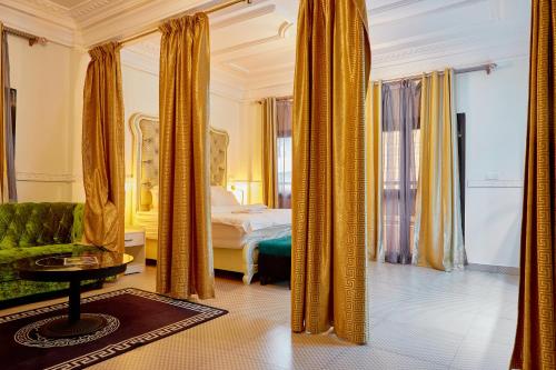 Ένα ή περισσότερα κρεβάτια σε δωμάτιο στο Convivium Home Hotel Appart