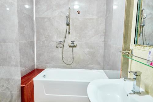 Ένα μπάνιο στο Convivium Home Hotel Appart