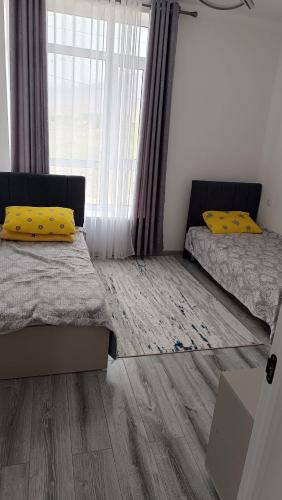 Postel nebo postele na pokoji v ubytování Коттедж