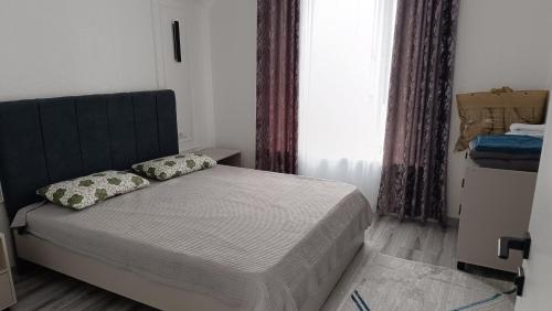 Postel nebo postele na pokoji v ubytování Коттедж