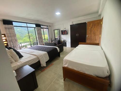 Postel nebo postele na pokoji v ubytování Babarakanda holiday resort