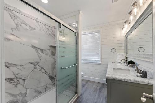 a bathroom with a shower and a sink at AV4-22: 4 22nd Avenue in Isle of Palms