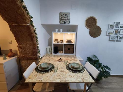 a dining room with a table and a table and chairs at Templar Arch Retreat in Tomar