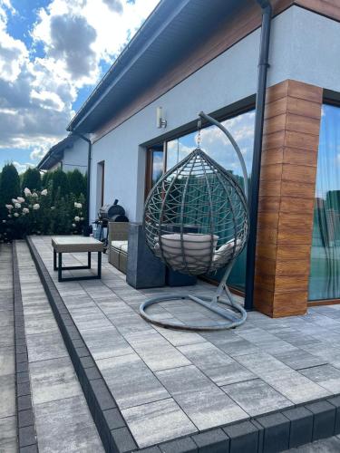 a large metal sphere sitting on a patio at Angela 的度假别墅 in Sękocin Stary