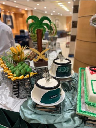 a table with three cakes on top at فندق برستيج اجياد in Ajyad