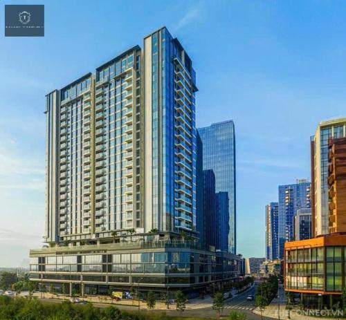 a large building in a city with tall buildings at The Metropole Deluxe Apartment View City in Ho Chi Minh City