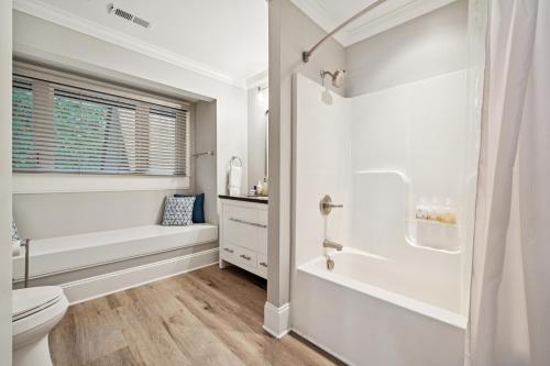 a white bathroom with a toilet and a shower at Paradise Peninsula in Lake Norman of Catawba