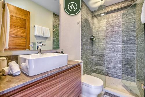 a bathroom with a sink and a shower at New 2 BR Condo One Street From Beach - Pool - Gym in Nuevo Nayarit