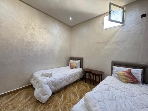 Ένα ή περισσότερα κρεβάτια σε δωμάτιο στο Dar Al Hassouni