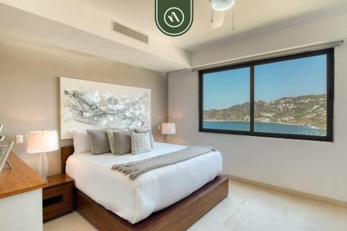 Ένα ή περισσότερα κρεβάτια σε δωμάτιο στο Luxury 4 BR Condo - Amazing Bay View - Pool