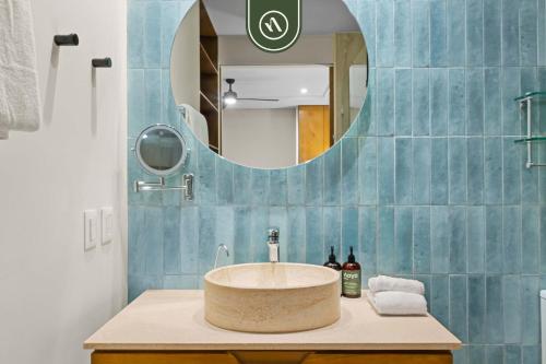 a bathroom with a sink and a mirror at New Stylish 1 BR Condo - Ocean Views - Flex Room in Bucerías
