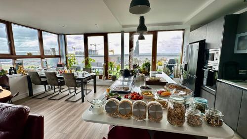 a table with food on it in a kitchen at James Clow Bed & Breakfast in Belfast