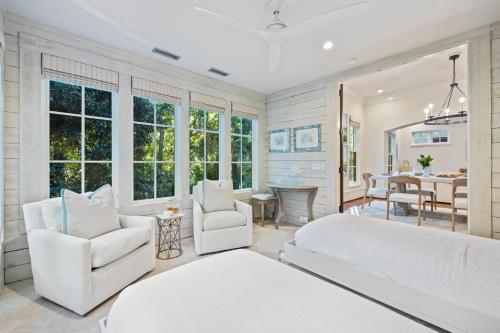 a bedroom with a large bed and a living room at 5556 Cypress Point in Kiawah Island