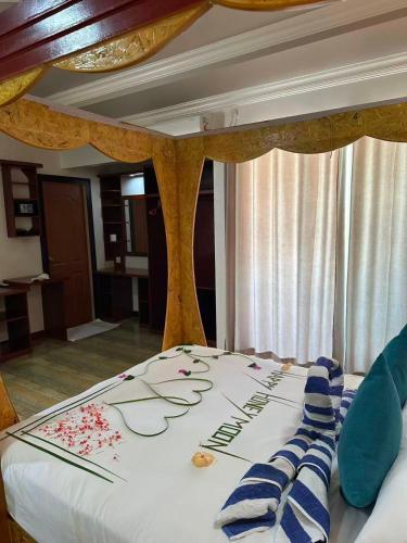 En eller flere senge i et værelse på Athens View