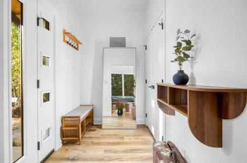 a hallway with a door leading into a house at Modern Cabin Retreat Easy Drive to Canton and Tyler in Chandler