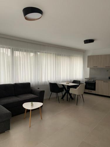 a living room with a couch and a table at Zlate Home in Zlatograd